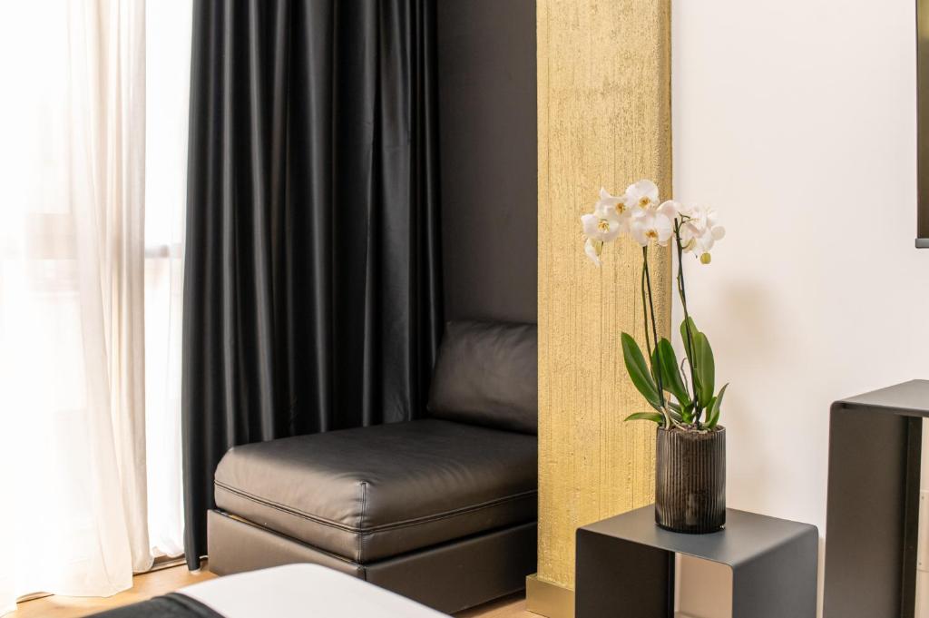 Łóżko lub łóżka w pokoju w obiekcie Plebiscito Boutique Rooms