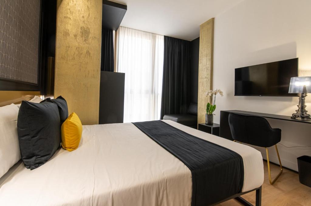 Łóżko lub łóżka w pokoju w obiekcie Plebiscito Boutique Rooms
