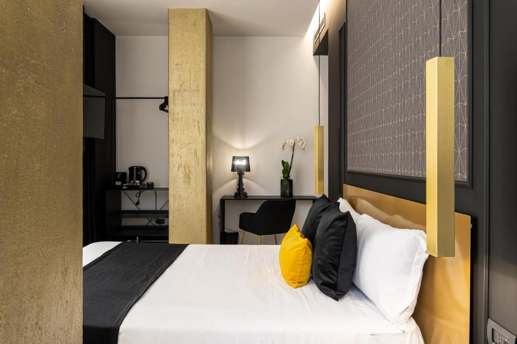 Łóżko lub łóżka w pokoju w obiekcie Plebiscito Boutique Rooms