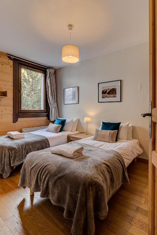 Posteľ alebo postele v izbe v ubytovaní Apartment le Paradis 1 - Alpes Travel - Central Chamonix (sleeps 4)