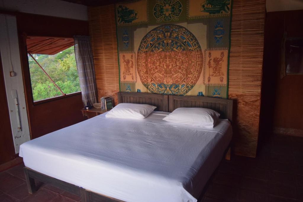 A bed or beds in a room at Casa Sakal