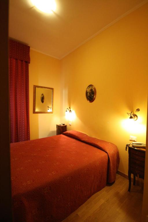 Postel nebo postele na pokoji v ubytování Hotel Termini