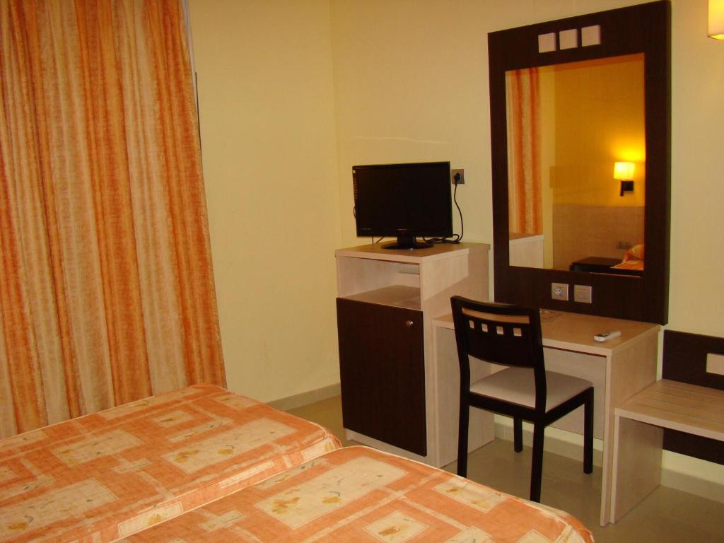 Postel nebo postele na pokoji v ubytování Hotel Ciutadella