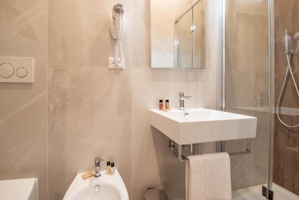 a bathroom with a sink and a toilet at DANY GUEST HOUSE in Rome