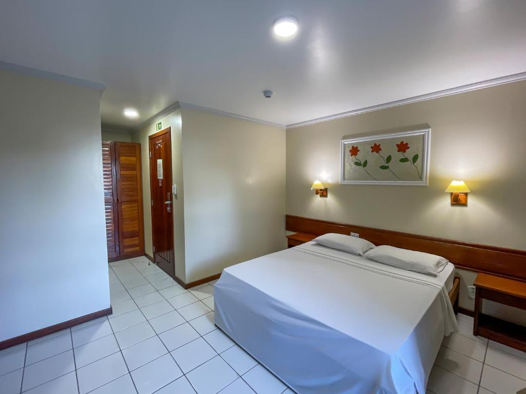 Postel nebo postele na pokoji v ubytování Porto Cálem Praia Hotel