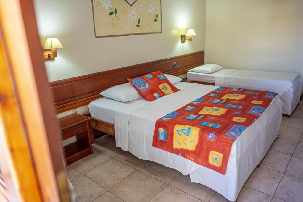 Postel nebo postele na pokoji v ubytování Porto Cálem Praia Hotel