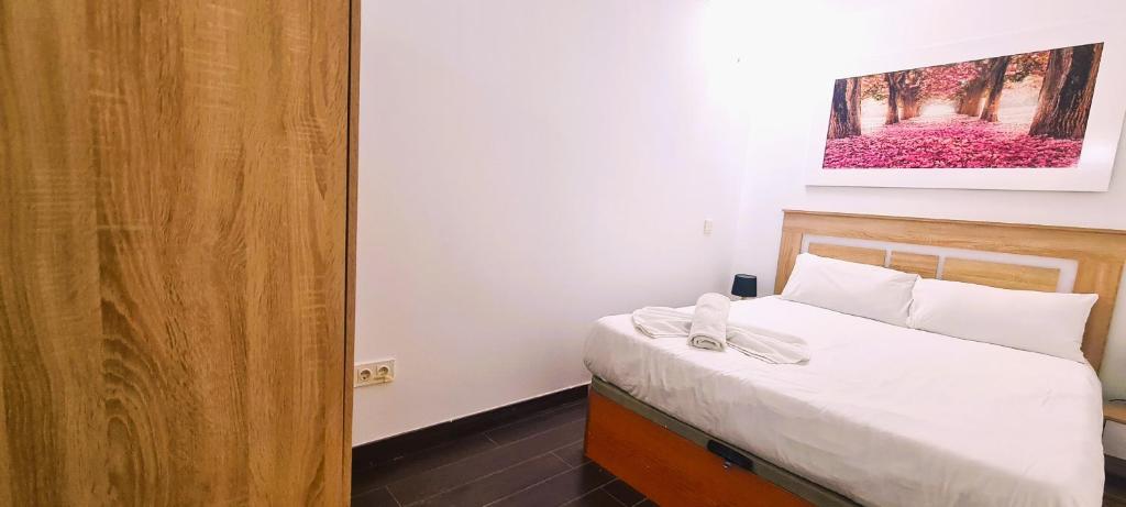 Postel nebo postele na pokoji v ubytování Oshun Sanchinarro