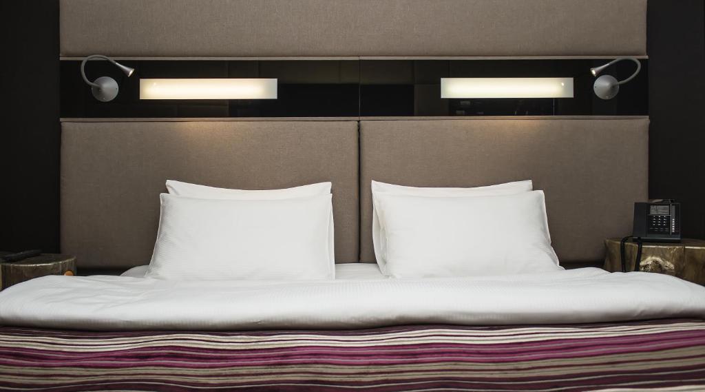 Postel nebo postele na pokoji v ubytování 11 Mirrors Design Hotel