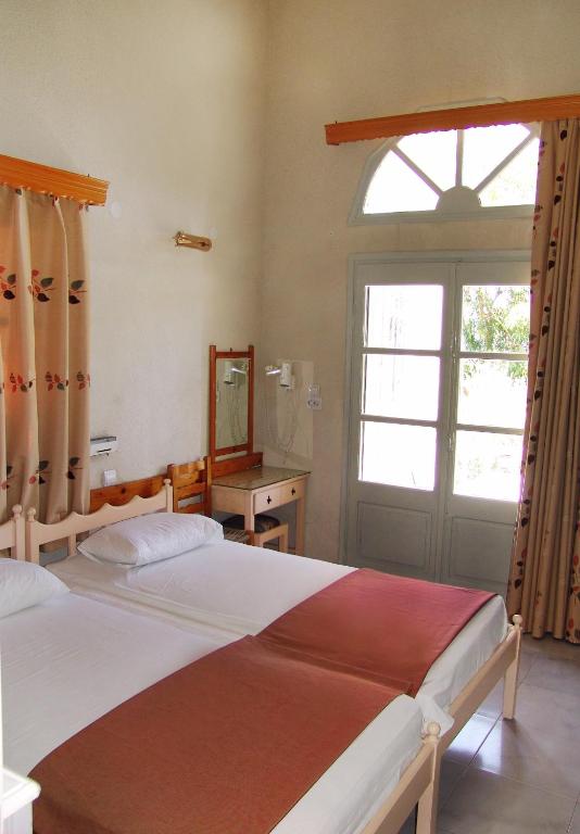 Postel nebo postele na pokoji v ubytování Alkyonis Apartments