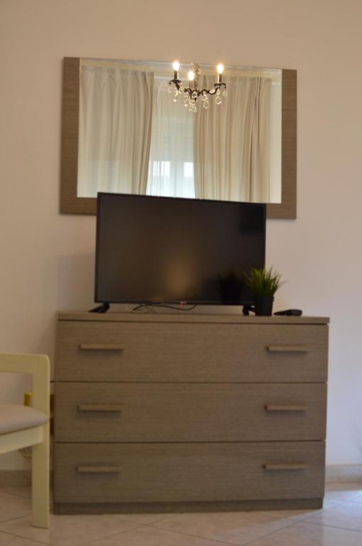 Telewizja i/lub zestaw kina domowego w obiekcie Pacific House