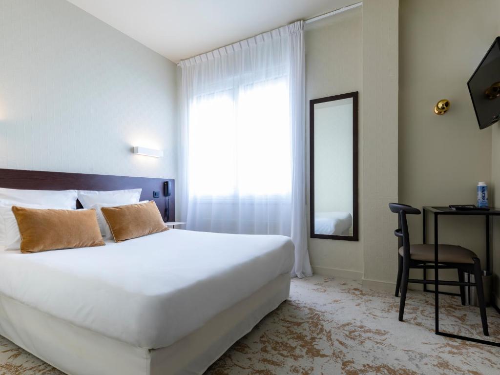 Postel nebo postele na pokoji v ubytování MOKA Hôtel