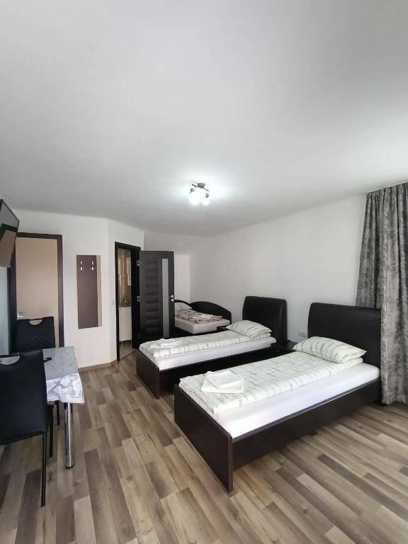 Postel nebo postele na pokoji v ubytování VILA GE
