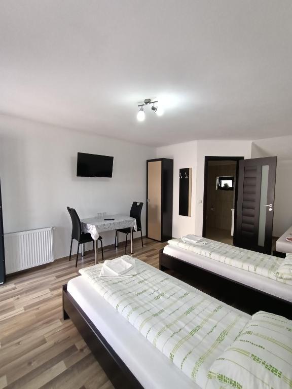 Postel nebo postele na pokoji v ubytování VILA GE