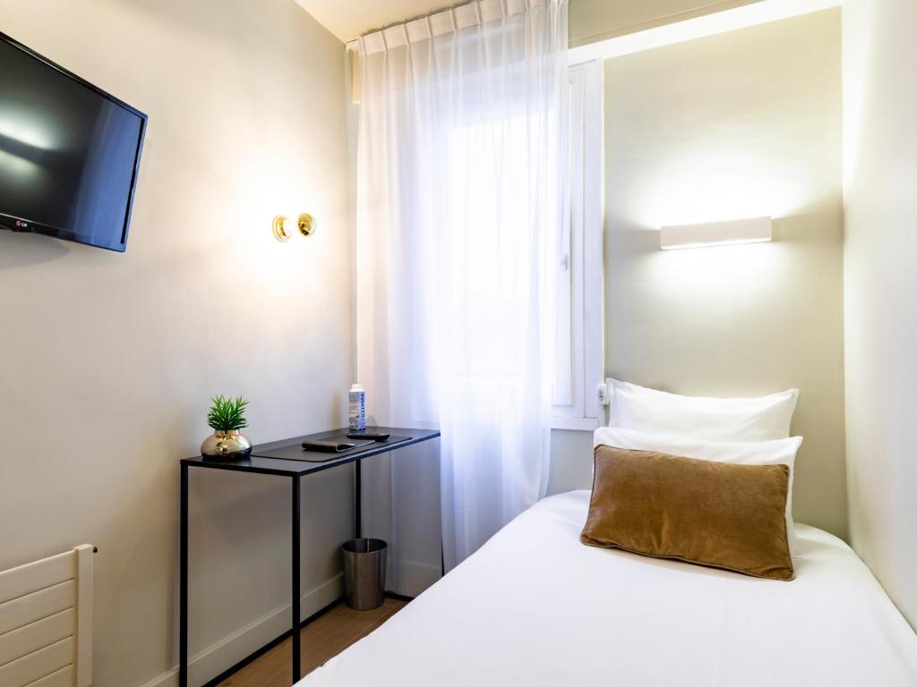 Postel nebo postele na pokoji v ubytování MOKA Hôtel