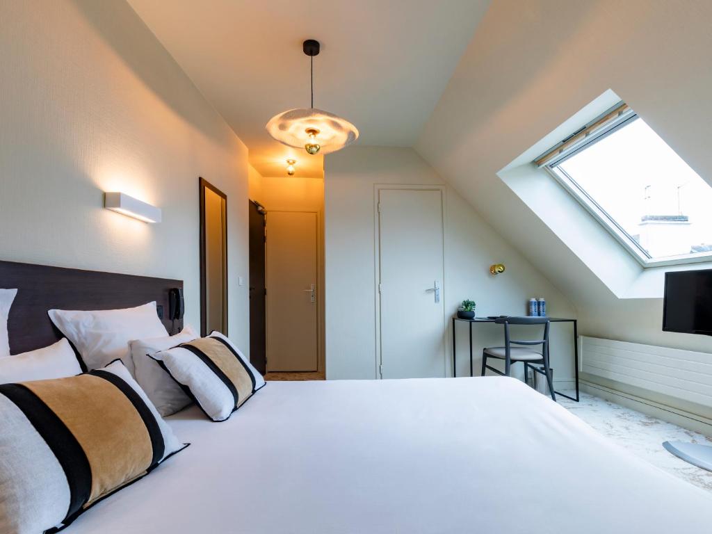 Postel nebo postele na pokoji v ubytování MOKA Hôtel