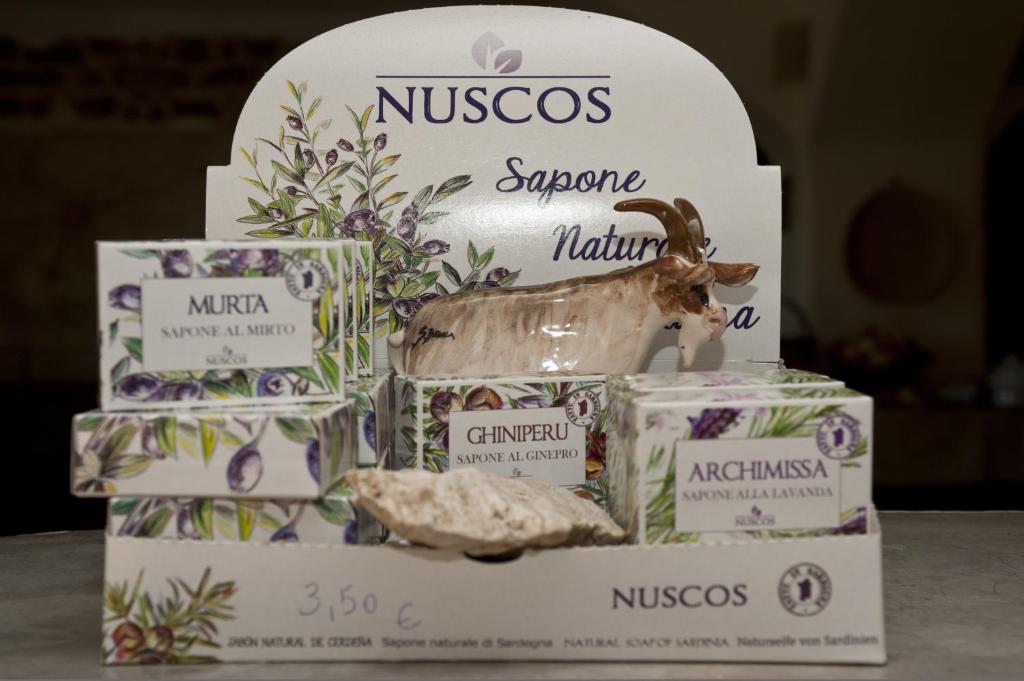 a box of nissos soap with a statue of a goat at Nascar Hotel in Santa Maria Navarrese