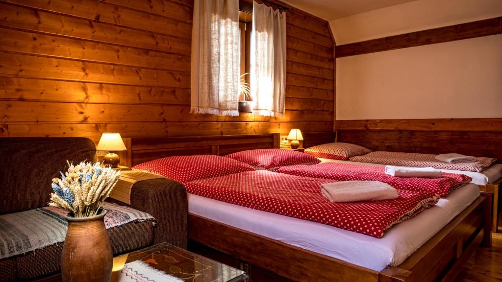 A bed or beds in a room at Penzion Barborka