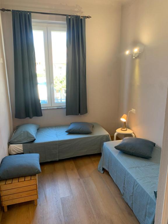 Postel nebo postele na pokoji v ubytování Piccola Dimora B&B