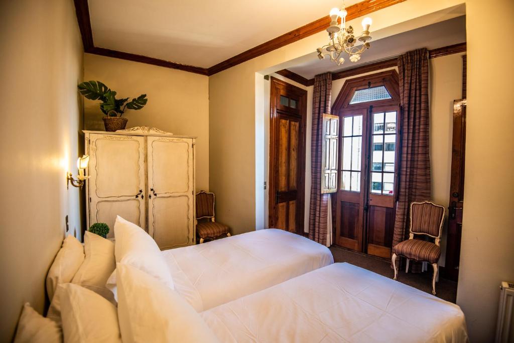 Postel nebo postele na pokoji v ubytování Gervasoni Hotel Boutique
