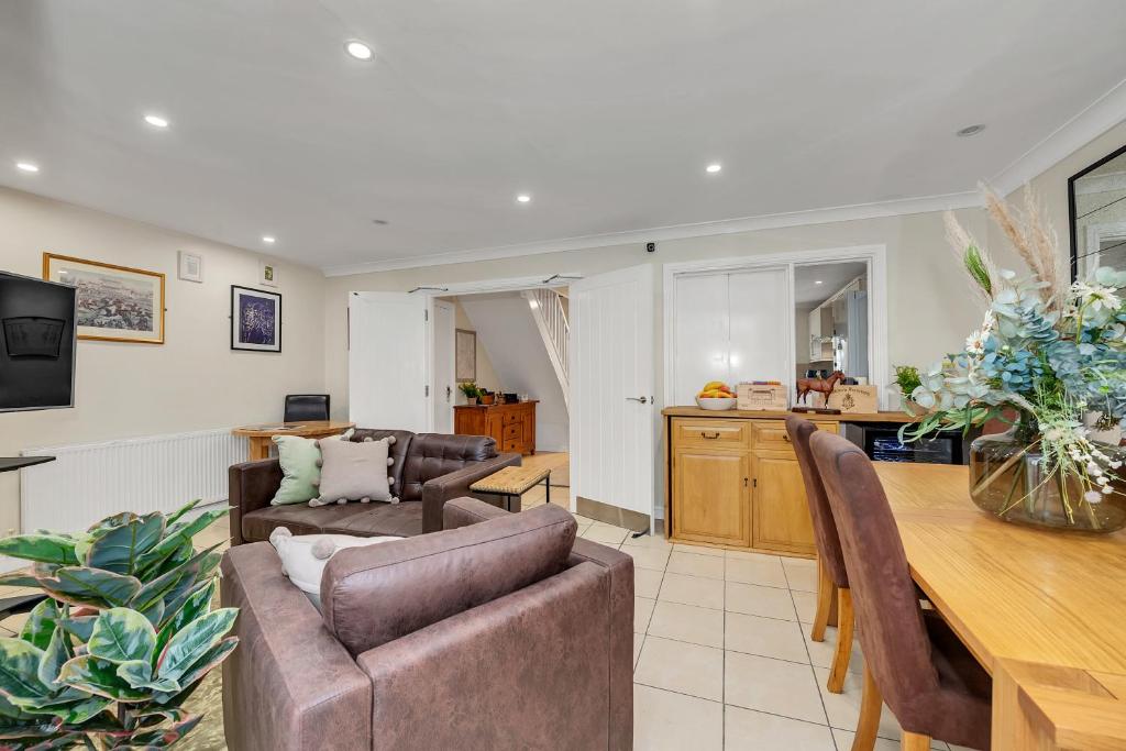 a living room with a couch and a table at The Cambridgeshire in Newmarket