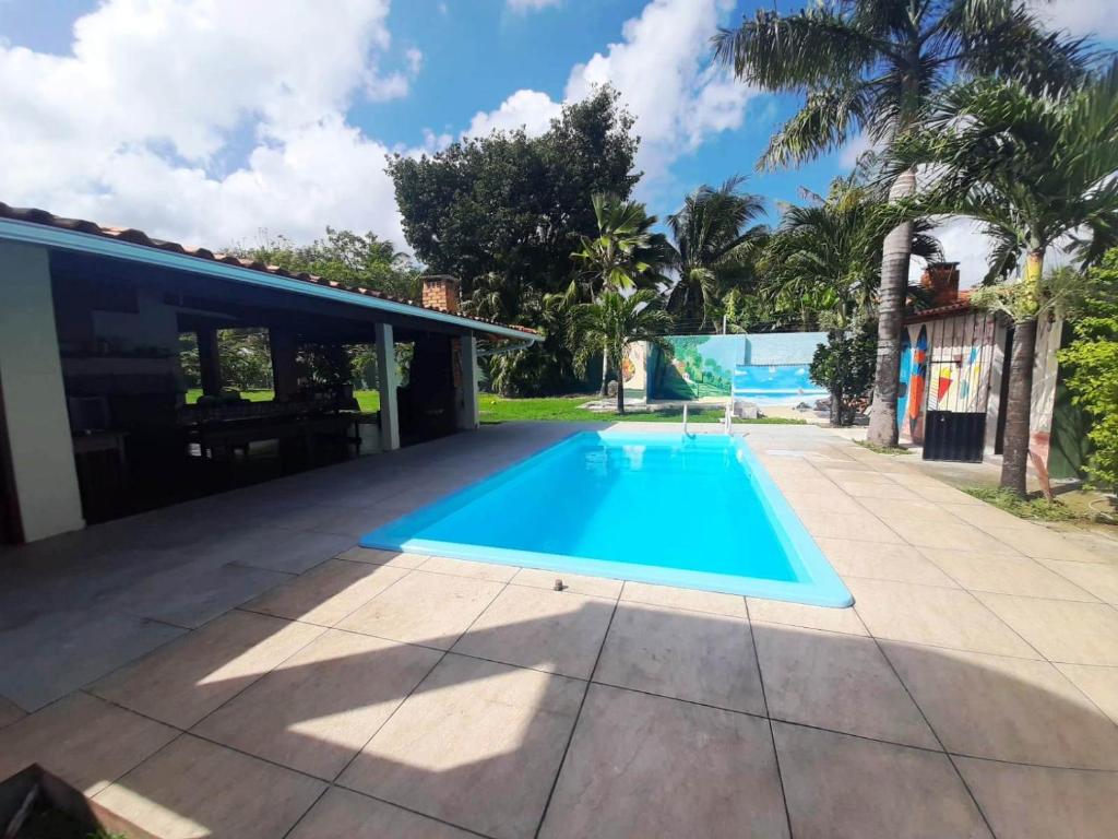 a swimming pool in the backyard of a house at Solar do Sal in Salinópolis