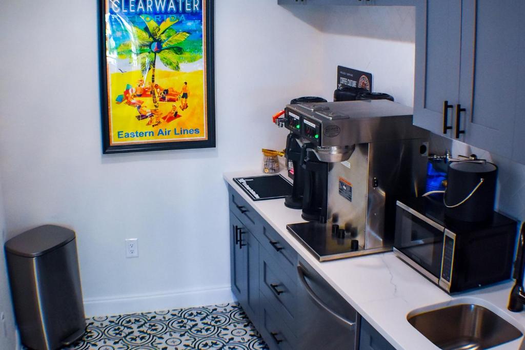 a kitchen with a coffee maker on a counter at Devon Shores in Clearwater Beach