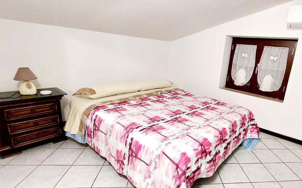 Кровать или кровати в номере La Mansardina