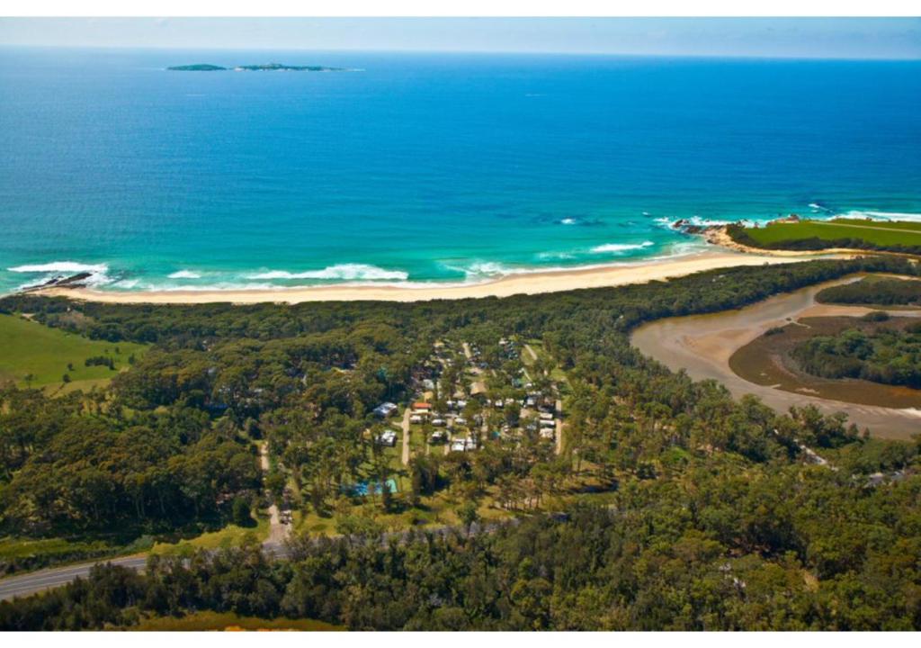 an aerial view of a beach and the ocean at Discovery Parks - Narooma Beach in Narooma