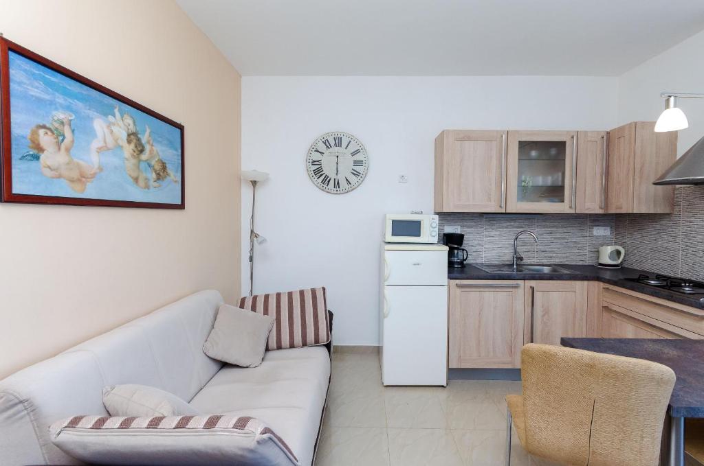 Kuchyň nebo kuchyňský kout v ubytování Apartments Marija G