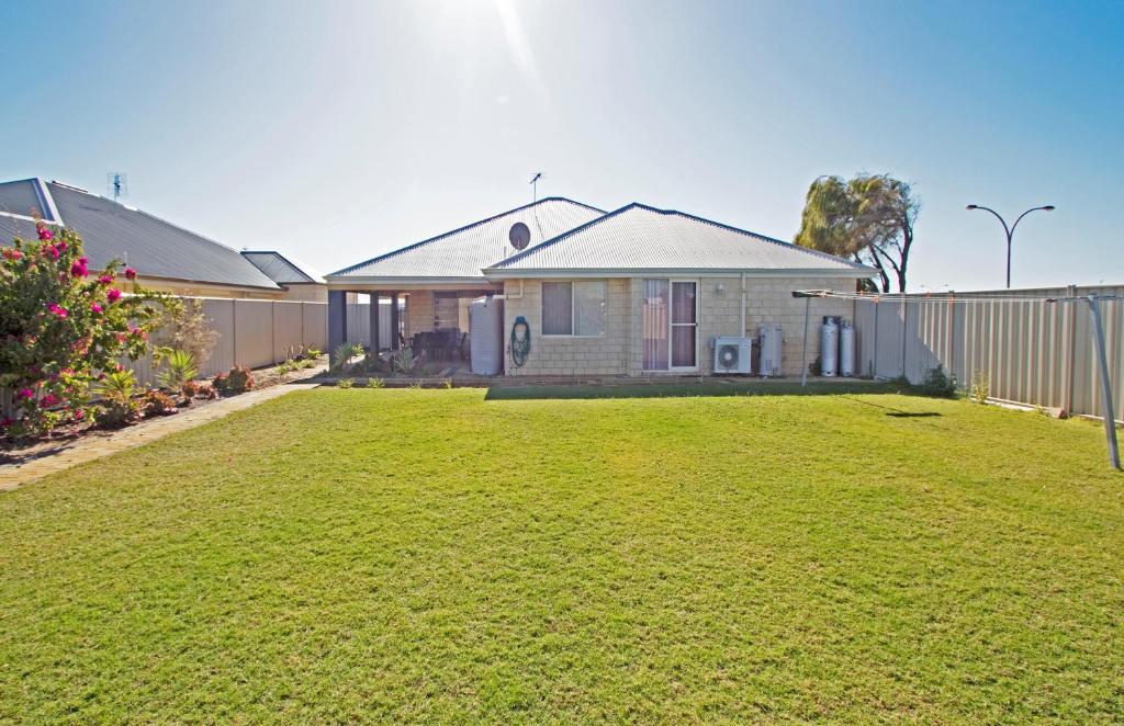 a house with a lawn in front of it at Boronia 4x2 in Jurien Bay