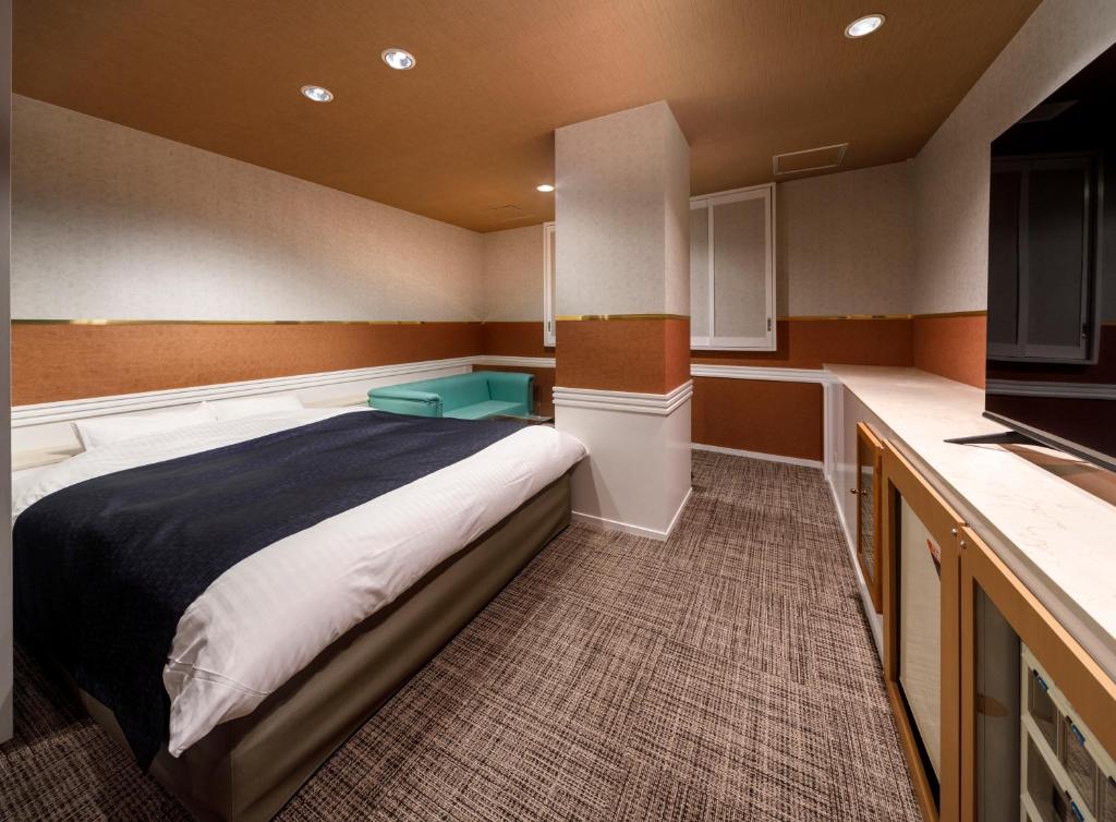 Postel nebo postele na pokoji v ubytování HOTEL HanaBi 長良の湯 -大人専用-