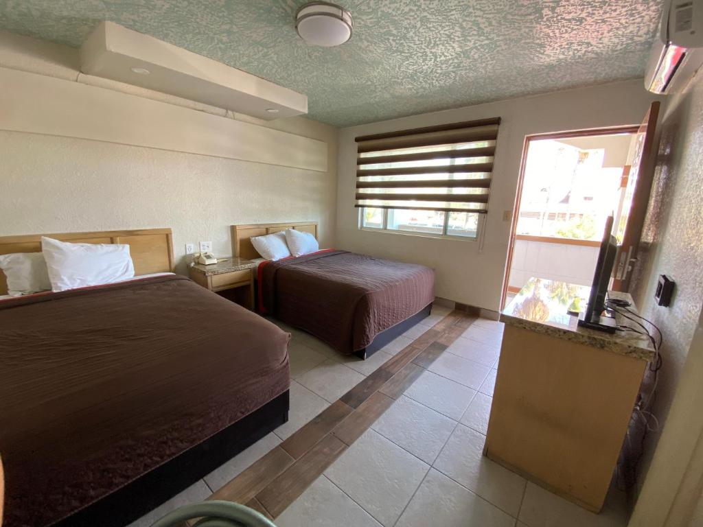 Postel nebo postele na pokoji v ubytování Motel Reno