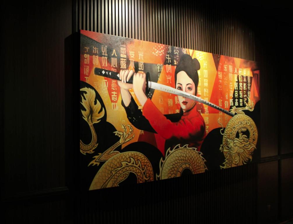 a poster of a woman holding a chopstick at Ashley Tang Menteng Jakarta in Jakarta