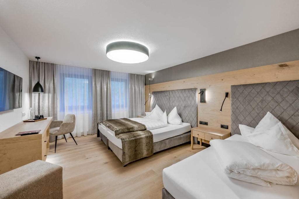 Postel nebo postele na pokoji v ubytování Hotel Grauer Bär
