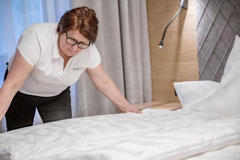 Postel nebo postele na pokoji v ubytování Hotel Grauer Bär