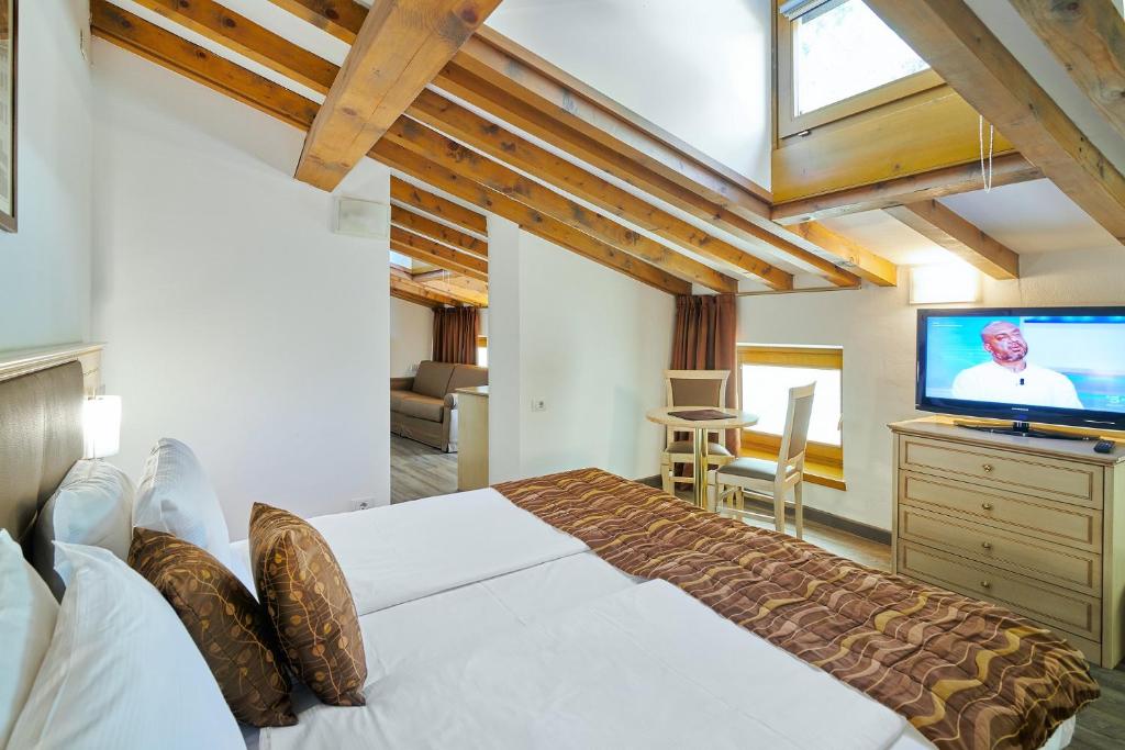 Postel nebo postele na pokoji v ubytování Hotel Portici - Romantik & Wellness