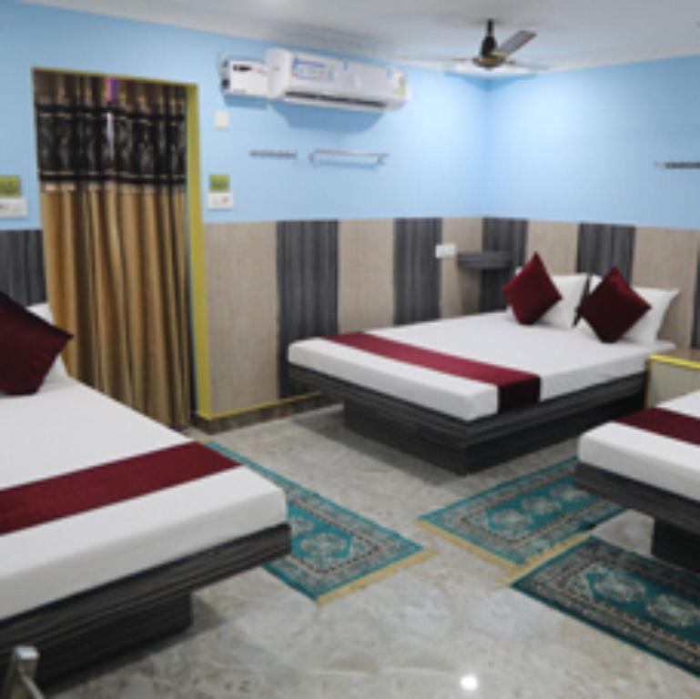 Ένα ή περισσότερα κρεβάτια σε δωμάτιο στο Chakravarthy Holidays