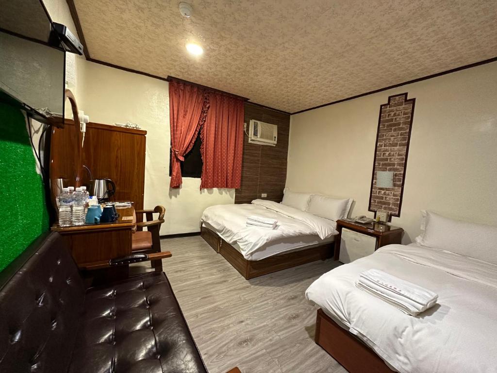 Postel nebo postele na pokoji v ubytování Ming Ren Hotspring Hotel
