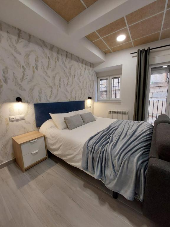 Кровать или кровати в номере Estudio Morella
