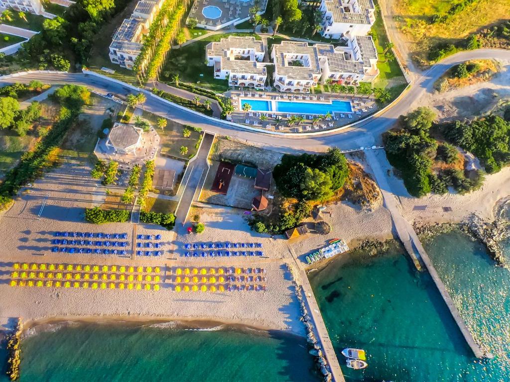 an aerial view of a resort on the beach at Porto Bello Beach Hotel in Kardamaina