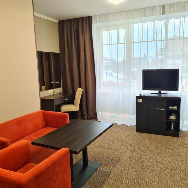 TV a/nebo společenská místnost v ubytování Bontiak Hotel