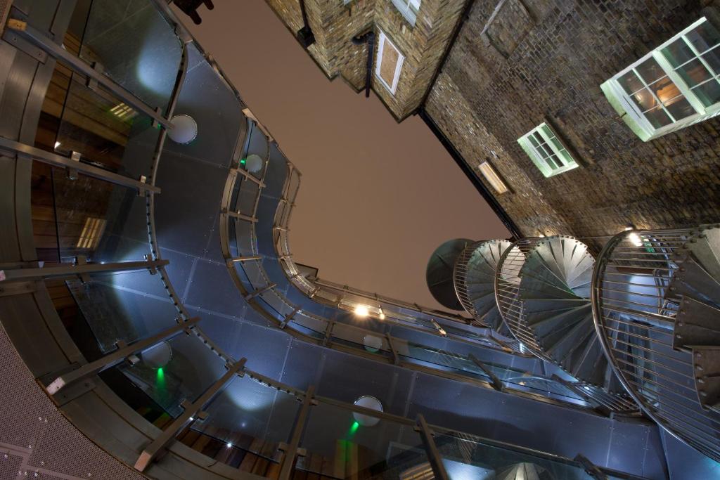 an overhead view of a spiral staircase in a building at The Z Hotel Soho in London