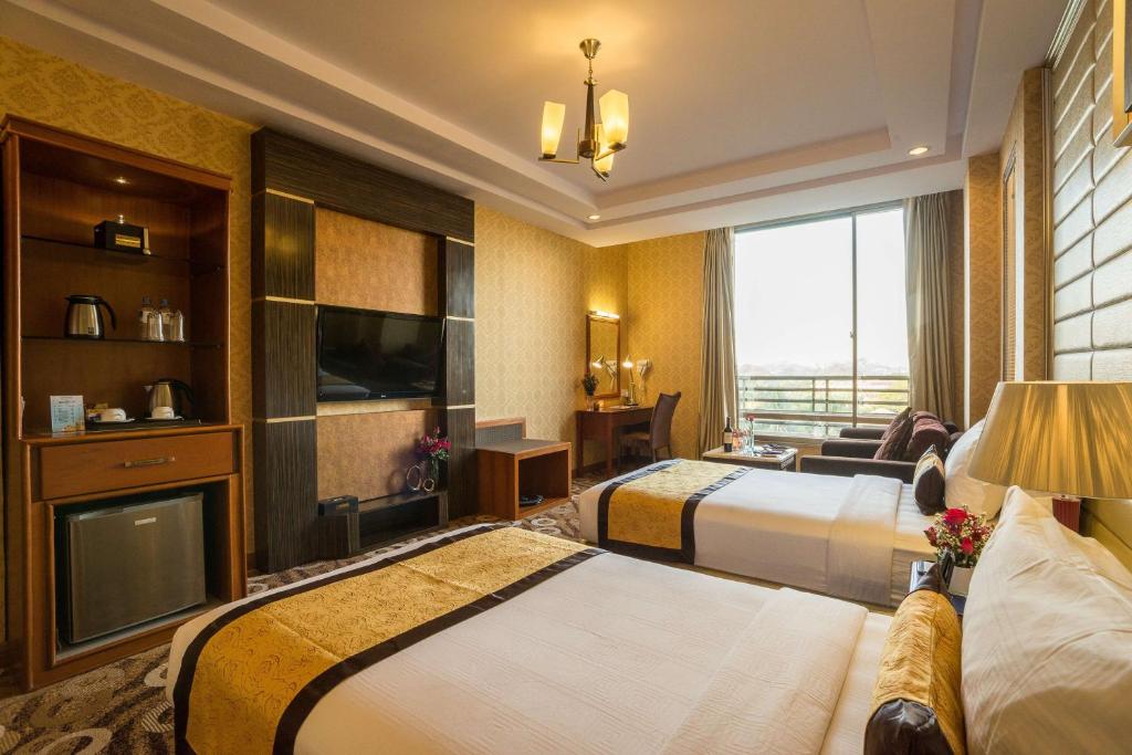 Voodi või voodid majutusasutuse Best Western Green Hill Hotel toas