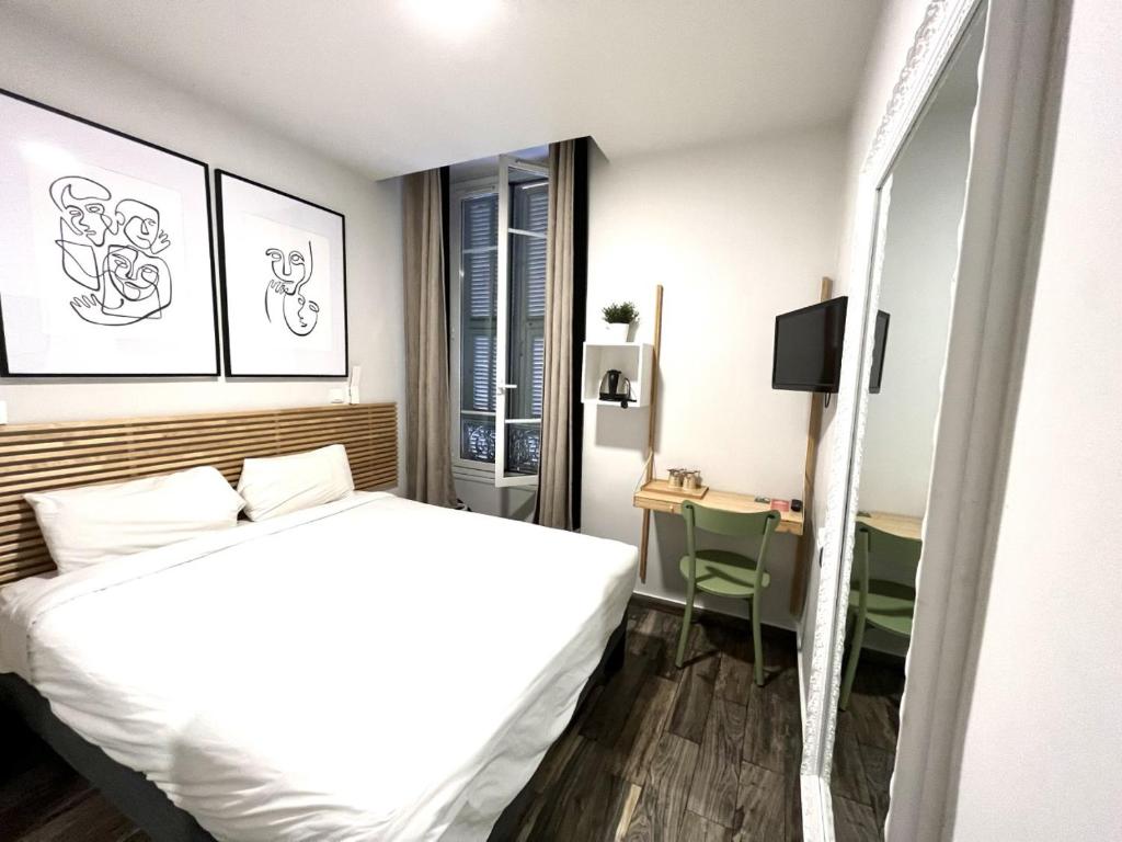 Postel nebo postele na pokoji v ubytování Hotel de Berne