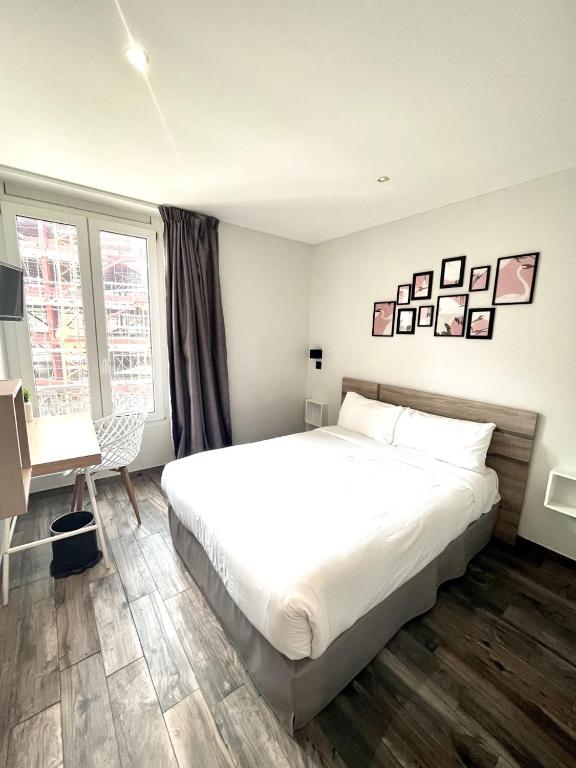 Postel nebo postele na pokoji v ubytování Hotel de Berne