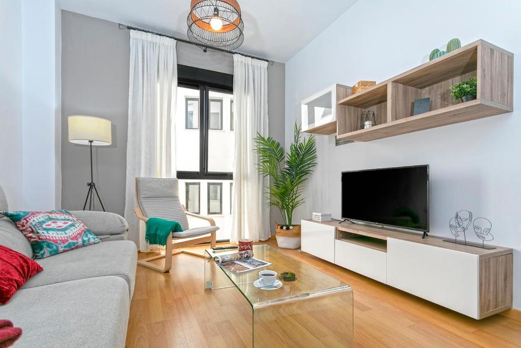 A television and/or entertainment centre at -MalagaSunApts- Central FreeParking RooftopPool
