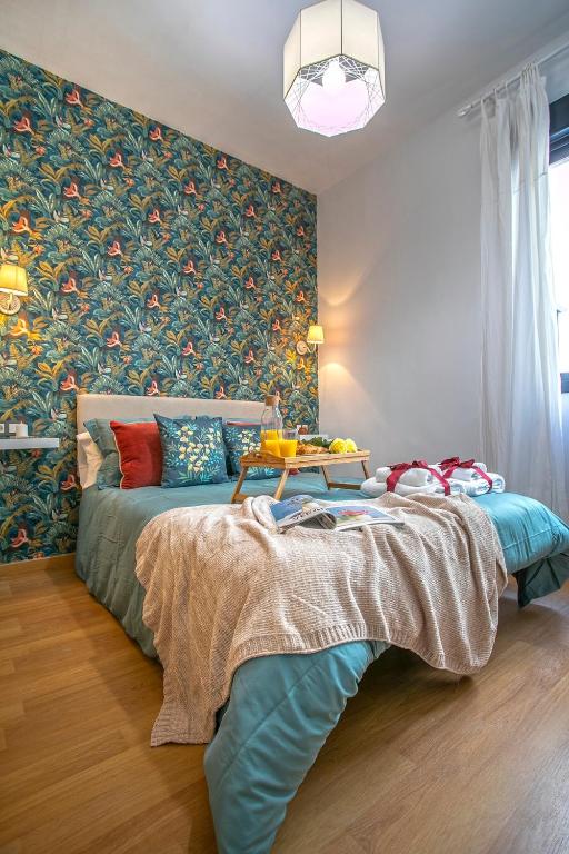 A bed or beds in a room at -MalagaSunApts- Central FreeParking RooftopPool