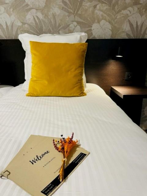 Postel nebo postele na pokoji v ubytování Bloomhotel