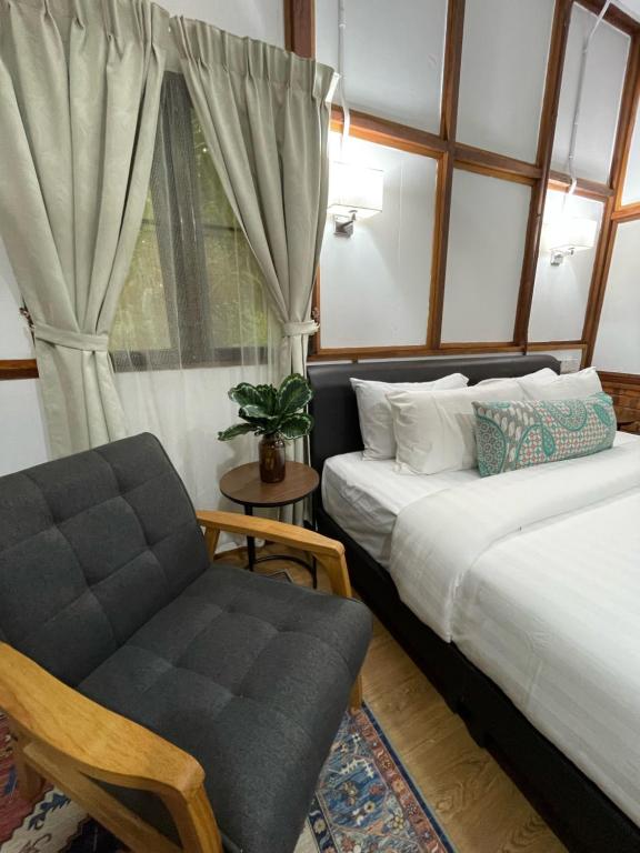 Postel nebo postele na pokoji v ubytování Api-api Eco Chalet