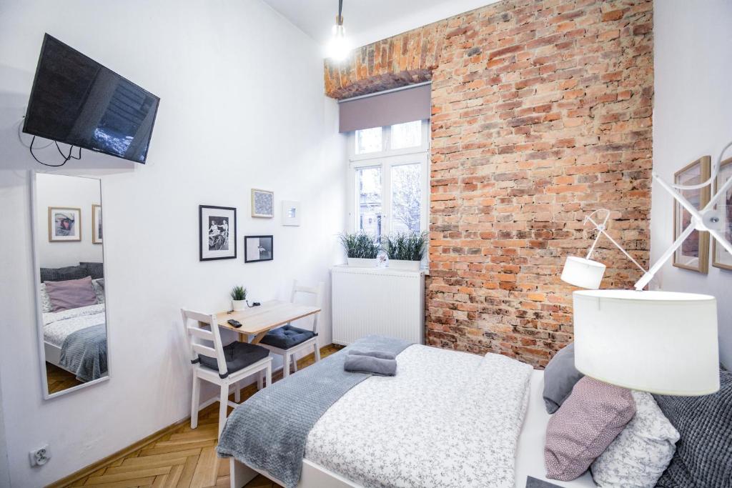 Posteľ alebo postele v izbe v ubytovaní LION apartments